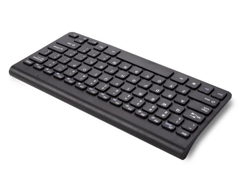 Black and white wireless keyboard and mouse set with USB receiver on wooden desk