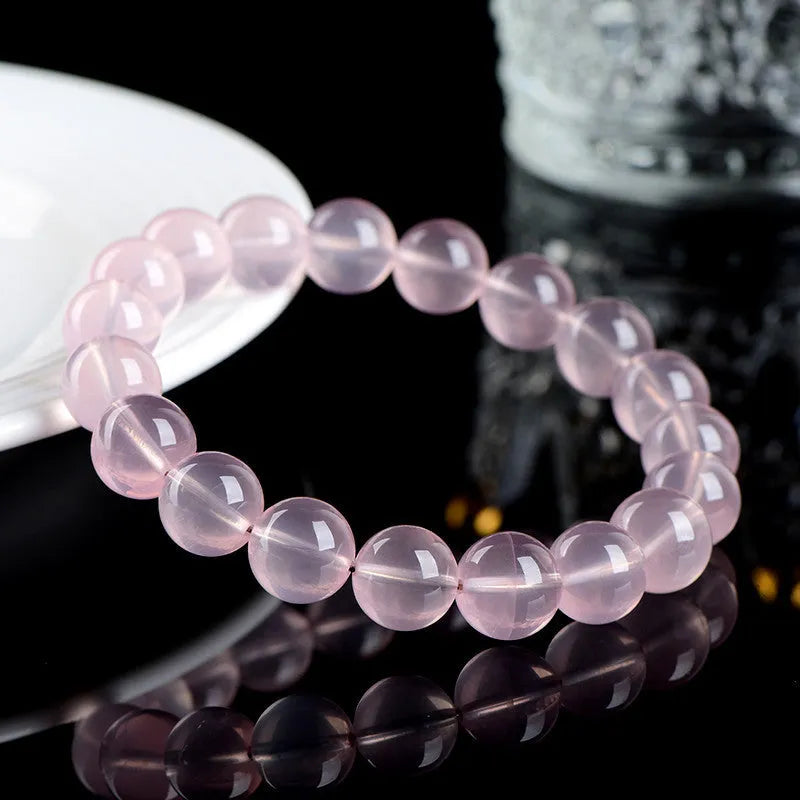 Women's natural starlight crystal bracelet with round pink beads in selectable sizes from 6mm to 22mm.