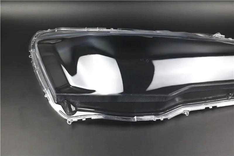 Transparent plastic headlight housing cover for vehicle lamp replacement measuring 50x30x20mm