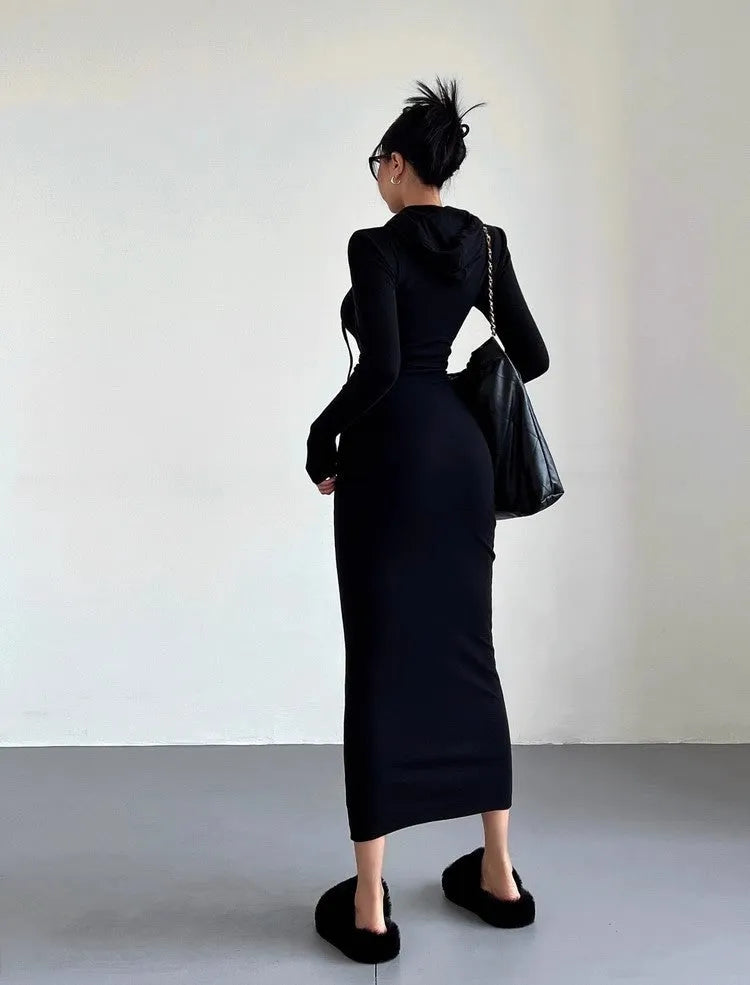 A woman's grey hooded long sleeve sheath dress with an over-the-knee length and high waist.