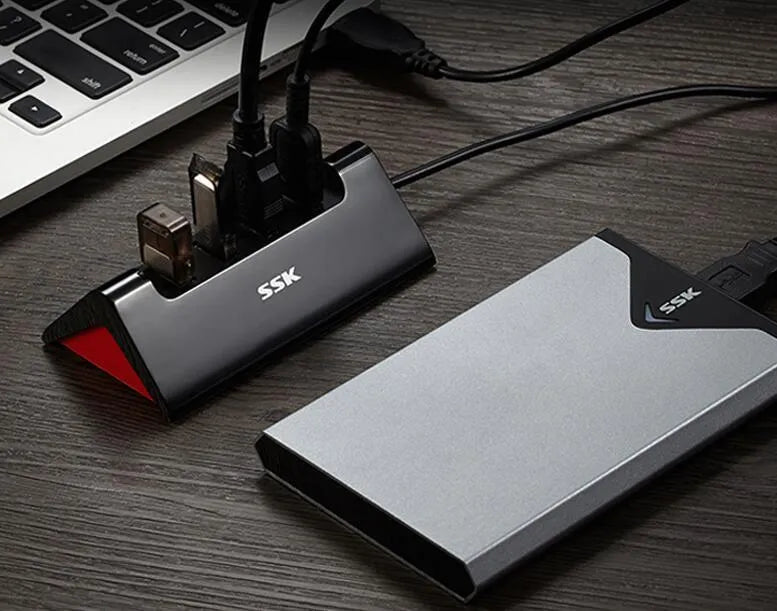 Black USB expansion dock with four USB ports and Micro USB power connection