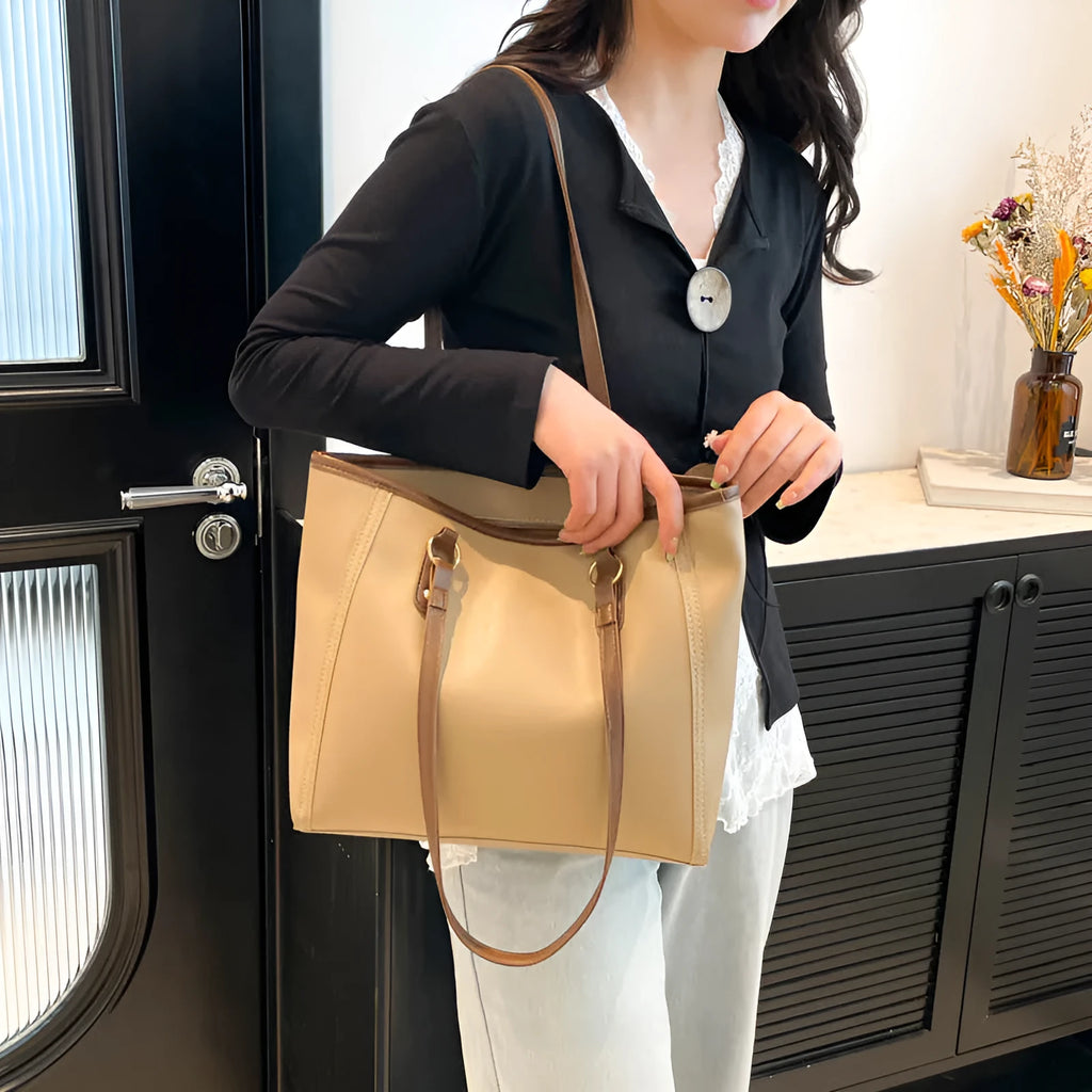 Contrast colour PU leather tote bag showing internal organisation compartments and external slit pocket