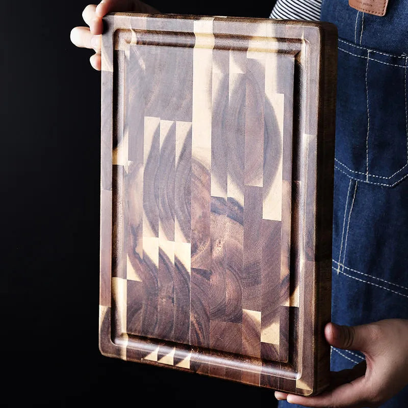 Brown acacia solid wood parquet cutting board with 3cm thickness on a kitchen counter.