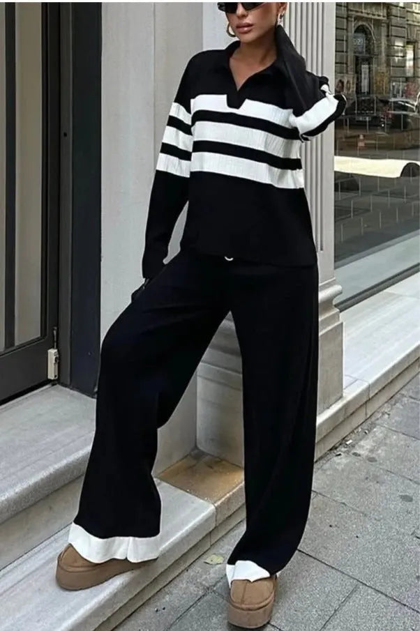 Women's black and white striped knitted two-piece set with polo collar top and matching trousers