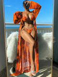 Floral pattern swimwear set with long sleeve blouse, banded bikini briefs, and matching outer robe in multiple colour options