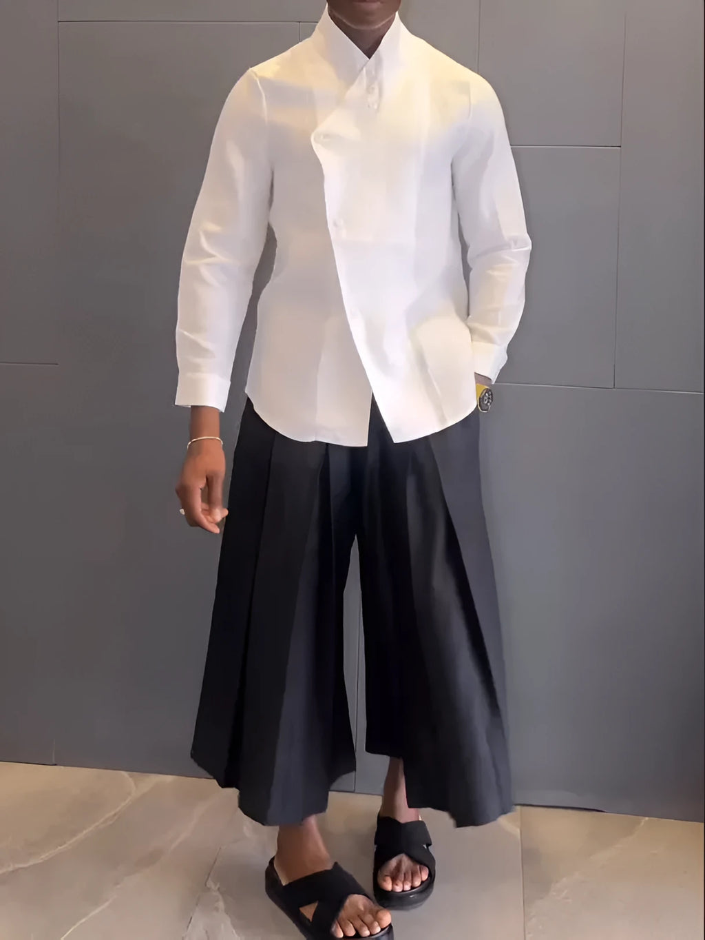 White asymmetric front women's shirt with black pleated trousers casual set