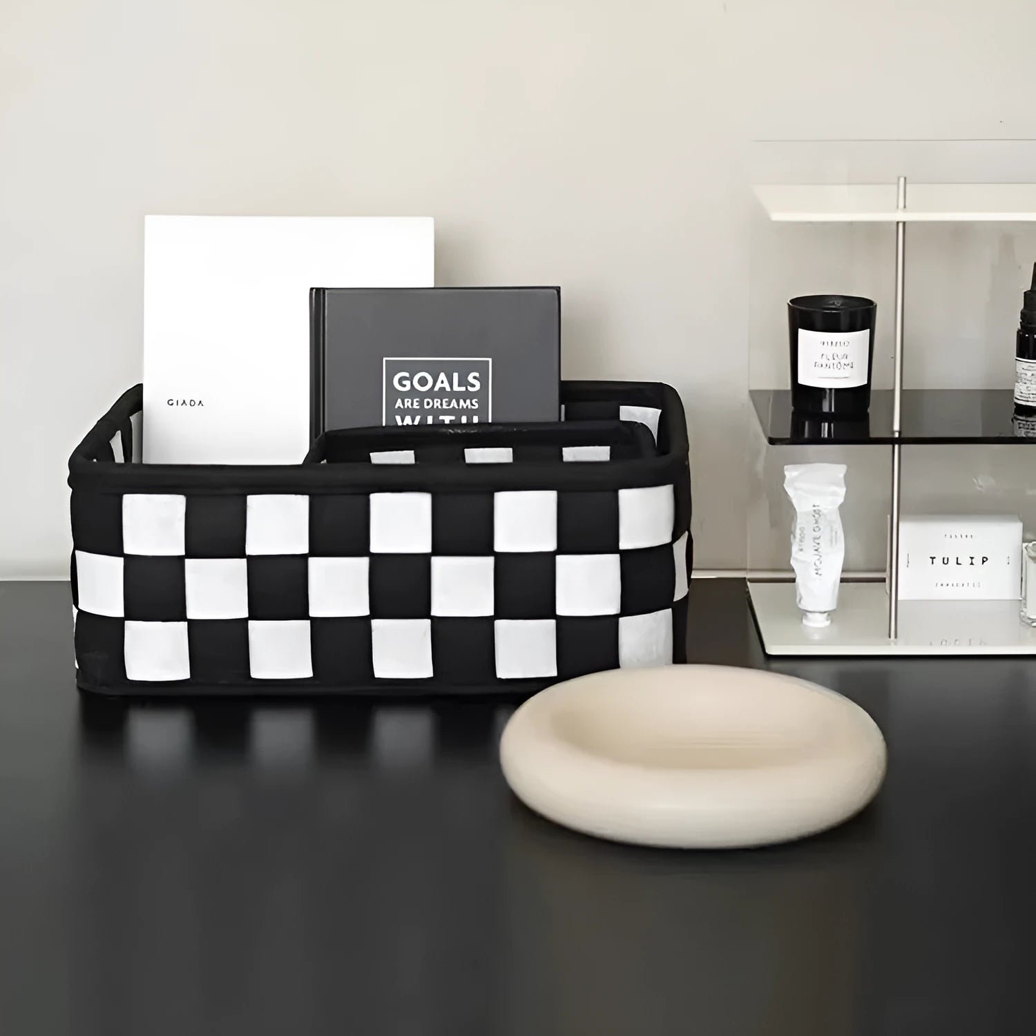 Checkerboard patterned foldable felt storage basket showing its box shape and textured sides.