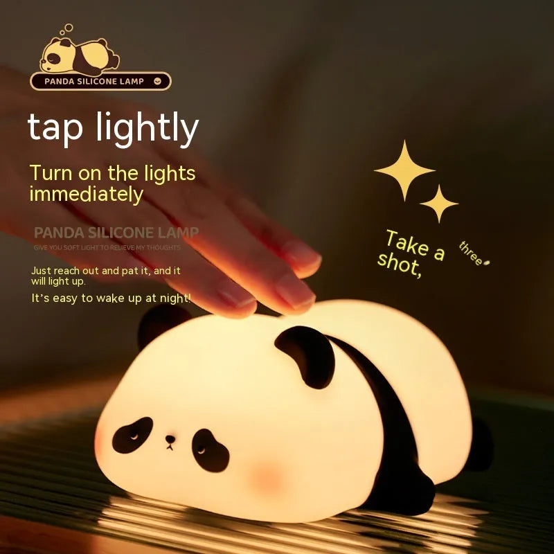 Cartoon panda-shaped night light with soft white glow on dark surface
