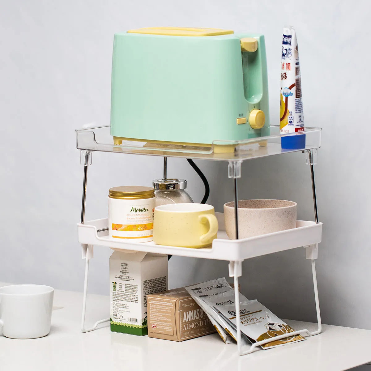 Transparent or white plastic kitchen supplies rack for countertop, cupboard and desktop organisation
