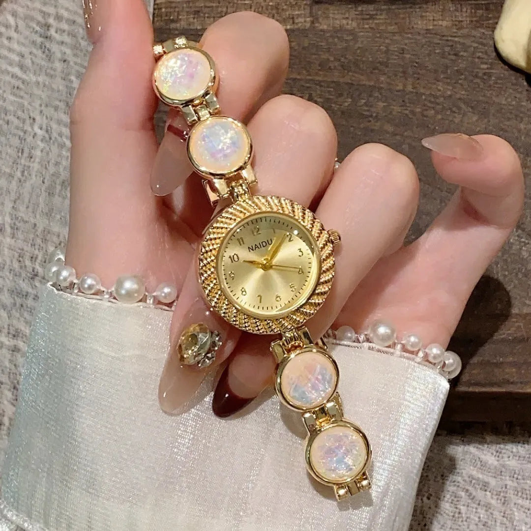 Women's round 25mm quartz watch in milky white with zinc alloy case.