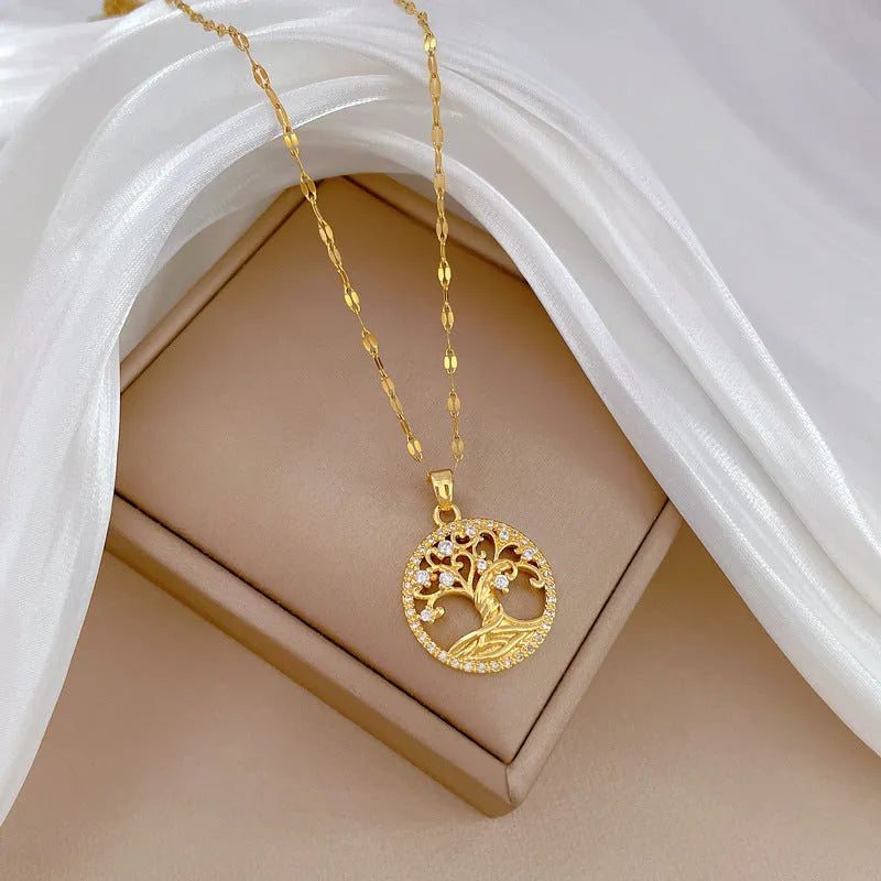 Gold-plated cross necklace with mother pearl pendant and full rhinestone detailing on adjustable stainless steel chain