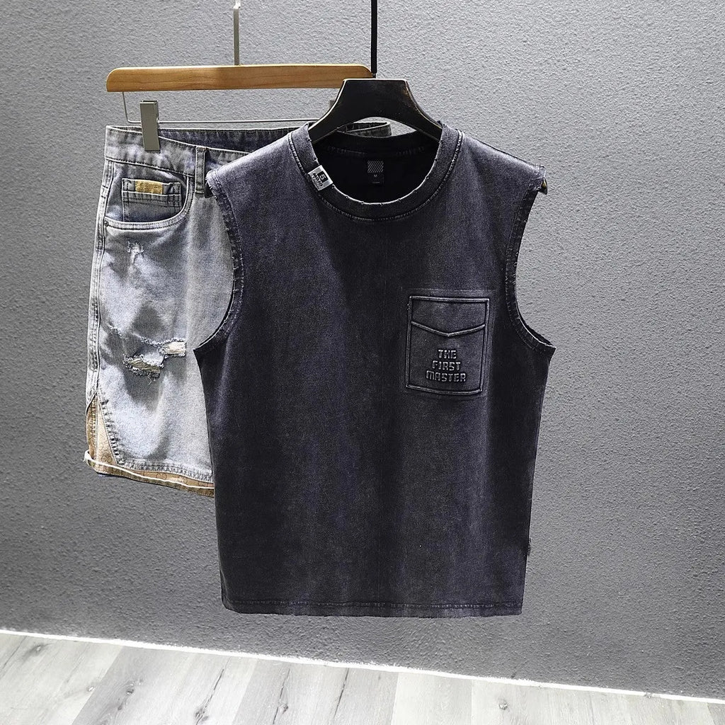 Man wearing a loose-fit black cotton sleeveless t-shirt or muscle tank.