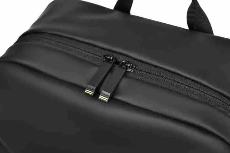 Waterproof large capacity PU backpack in black, blue, or grey with simple design