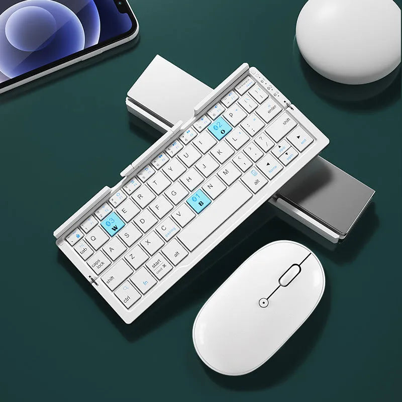 Silver aluminium folding Bluetooth keyboard with stand holding smartphone