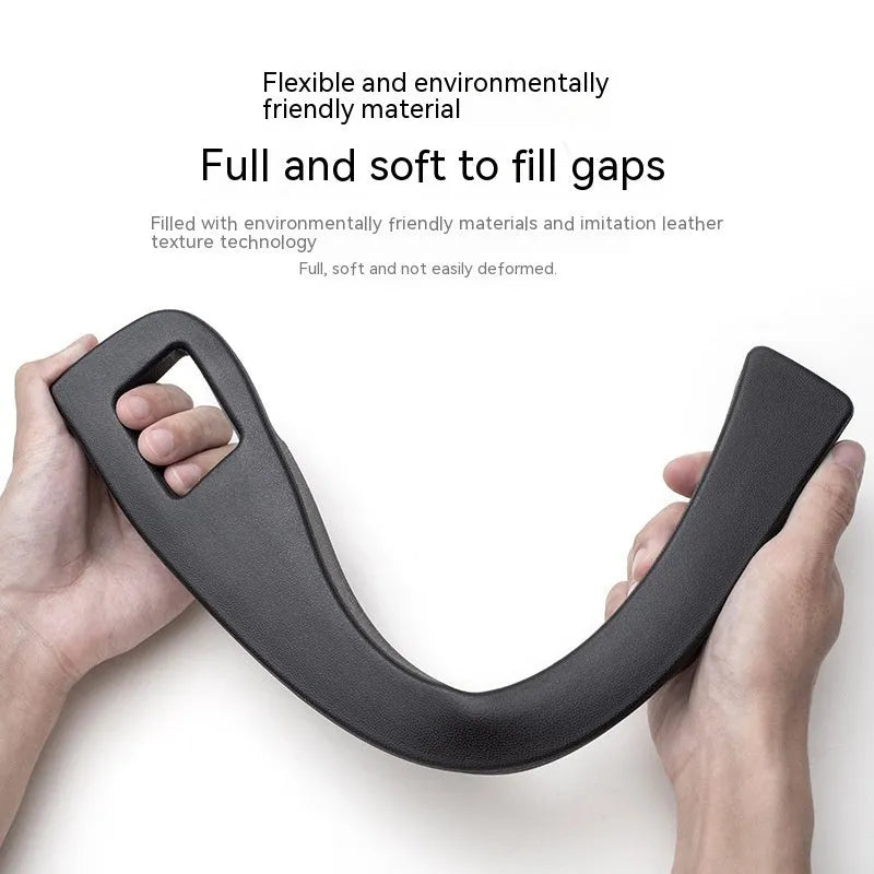 Black plastic car seat gap storage box organiser with handle between car seat and console