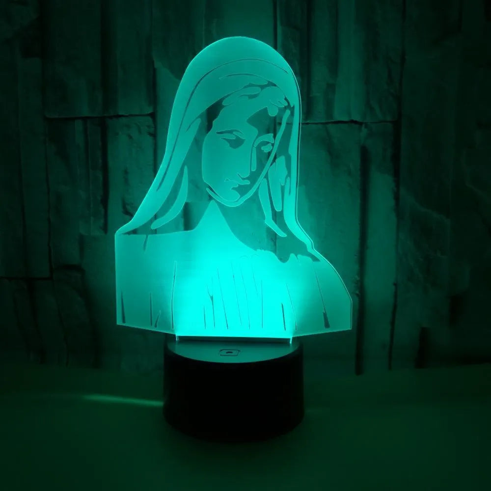3D LED night light showing colourful dual ring pattern on acrylic panel, with remote control on desk.