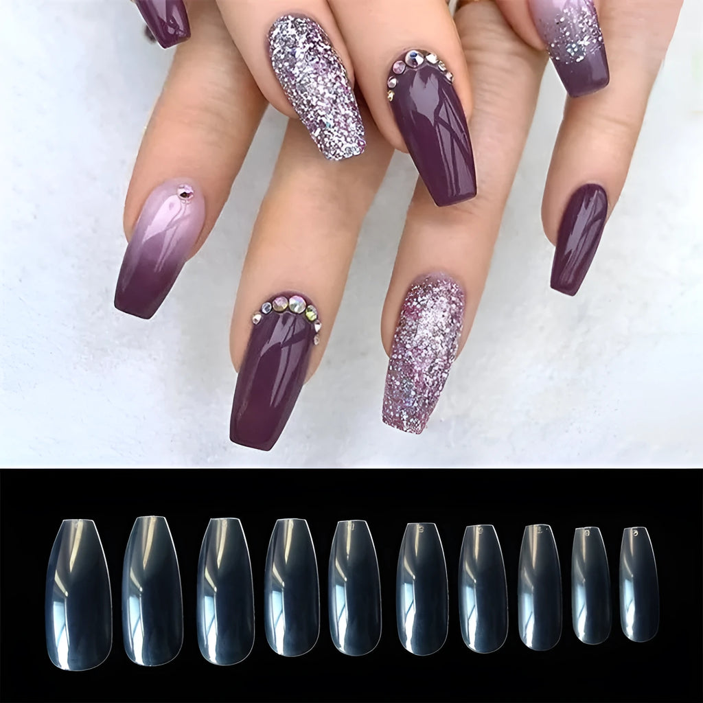 500 clear natural ABS fake nails in various sizes arranged with nail tools