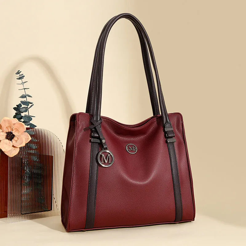 Women's retro style large black PU crossbody bag with double shoulder strap shown open.
