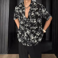 Loose casual short sleeve shirt with a floral print in a cardigan style.