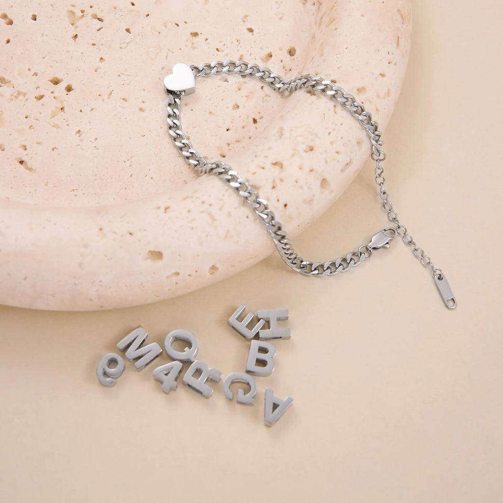 Gold titanium steel necklace with the letter 'A' pendant on a blade chain, 40.5cm long.