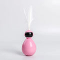 ABS tumbler cat toy with feather replacements, available in white, yellow, and pink