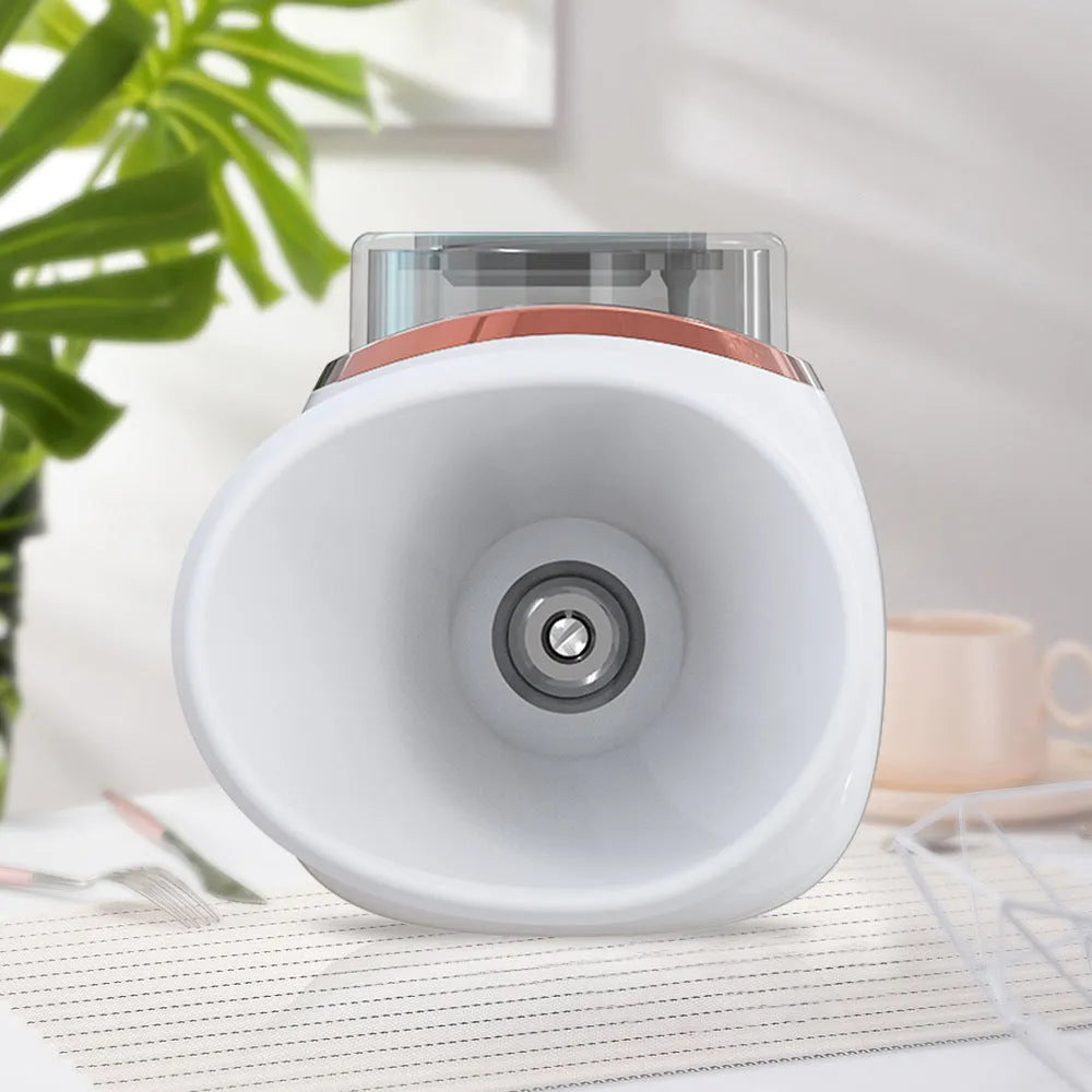 White and purple portable household eye humidifier with charging cable on a table