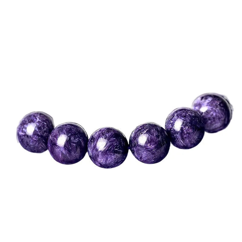 Natural transparent charoite crystal bracelet on platinum thread, showing different bead size options.