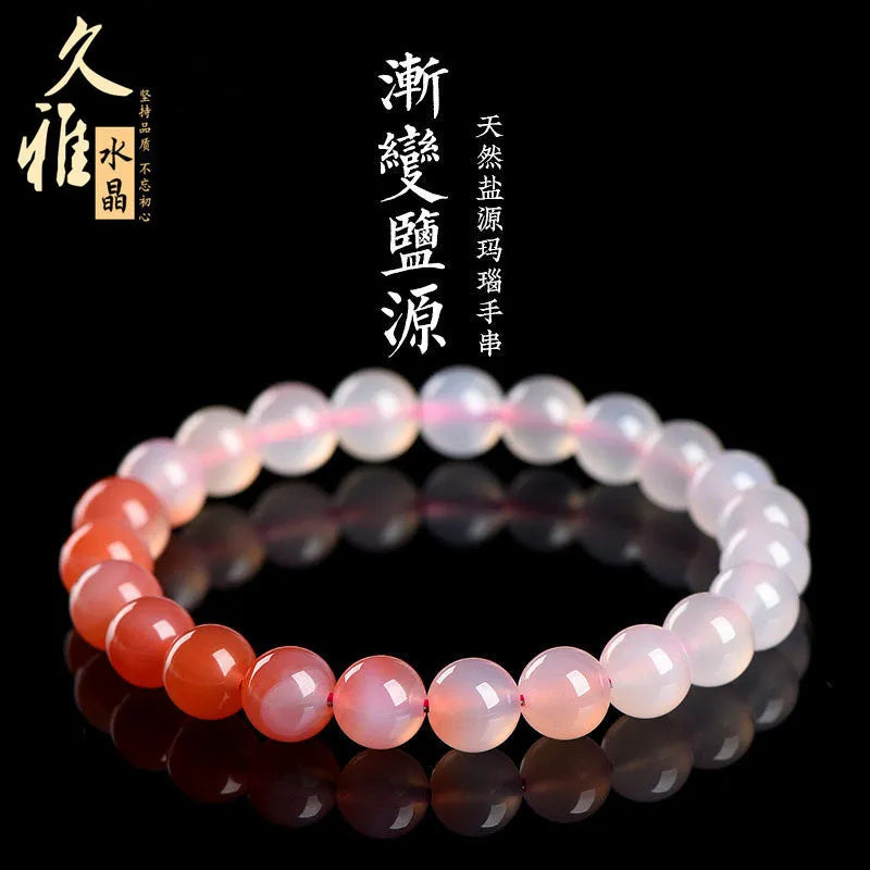 Natural gradient Yanyuan agate bracelet in geometric beads on a wrist.
