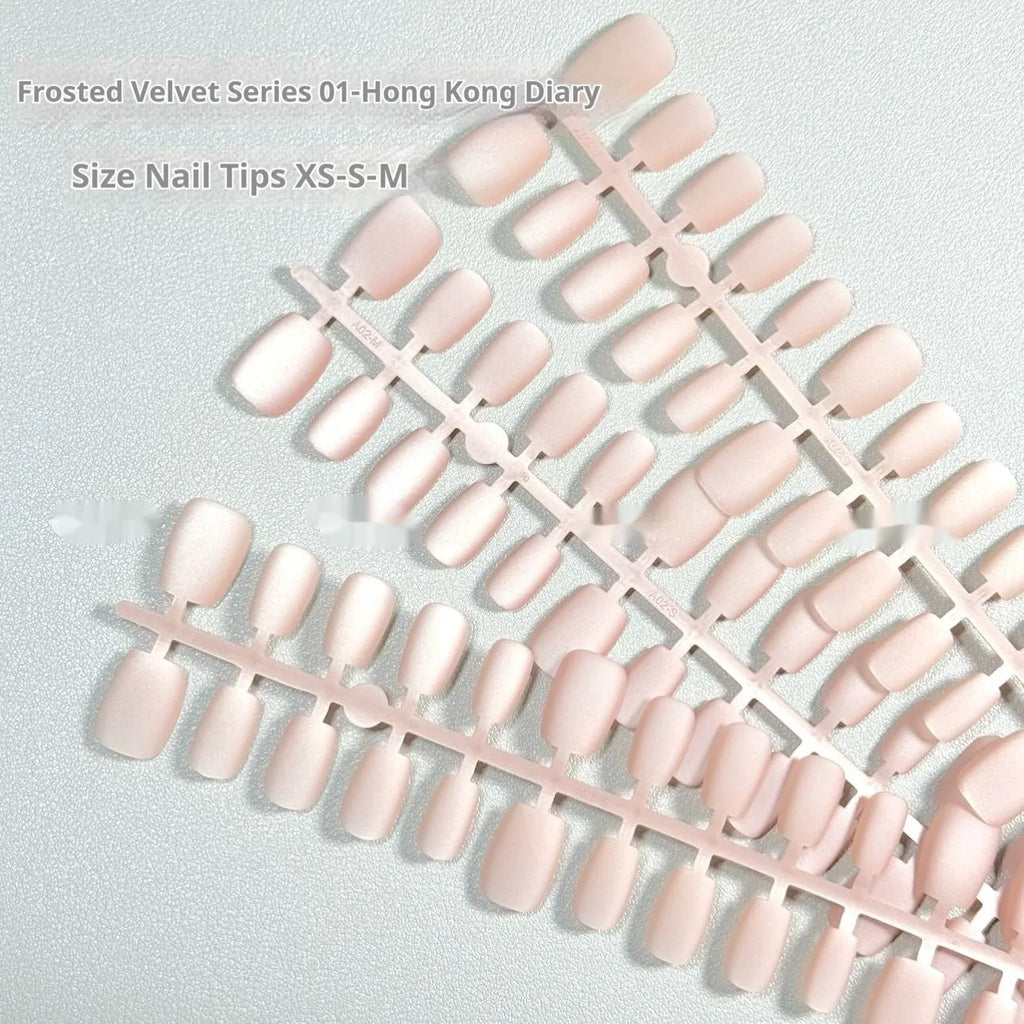 Set of frosted velvet Cat's Eye nail art wraps showing aurora and solid colour designs on short ladder sizes.