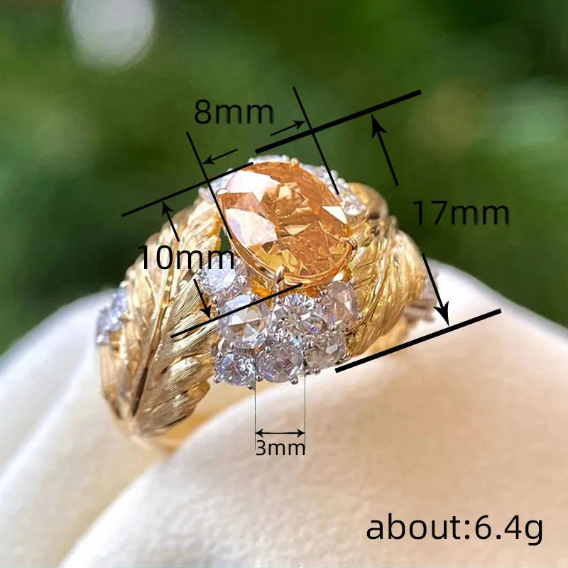 Gold-colour copper women's ring with embossed feather design and inlaid yellow zircon stone