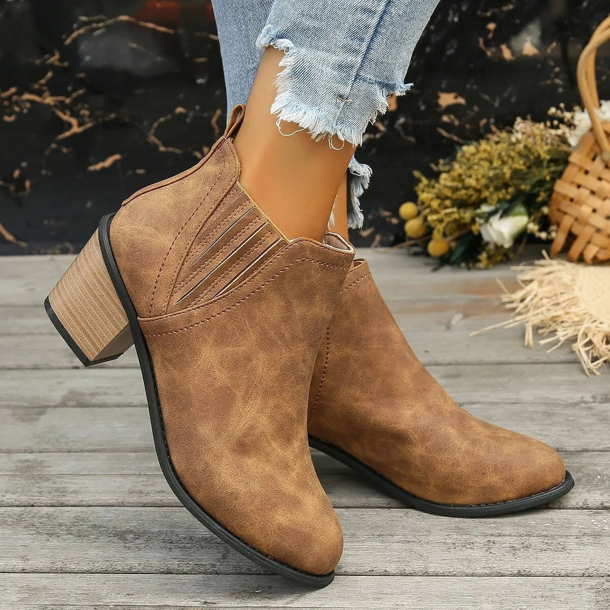 Women's black pointed toe ankle boots with thick square low heel and slip-on design