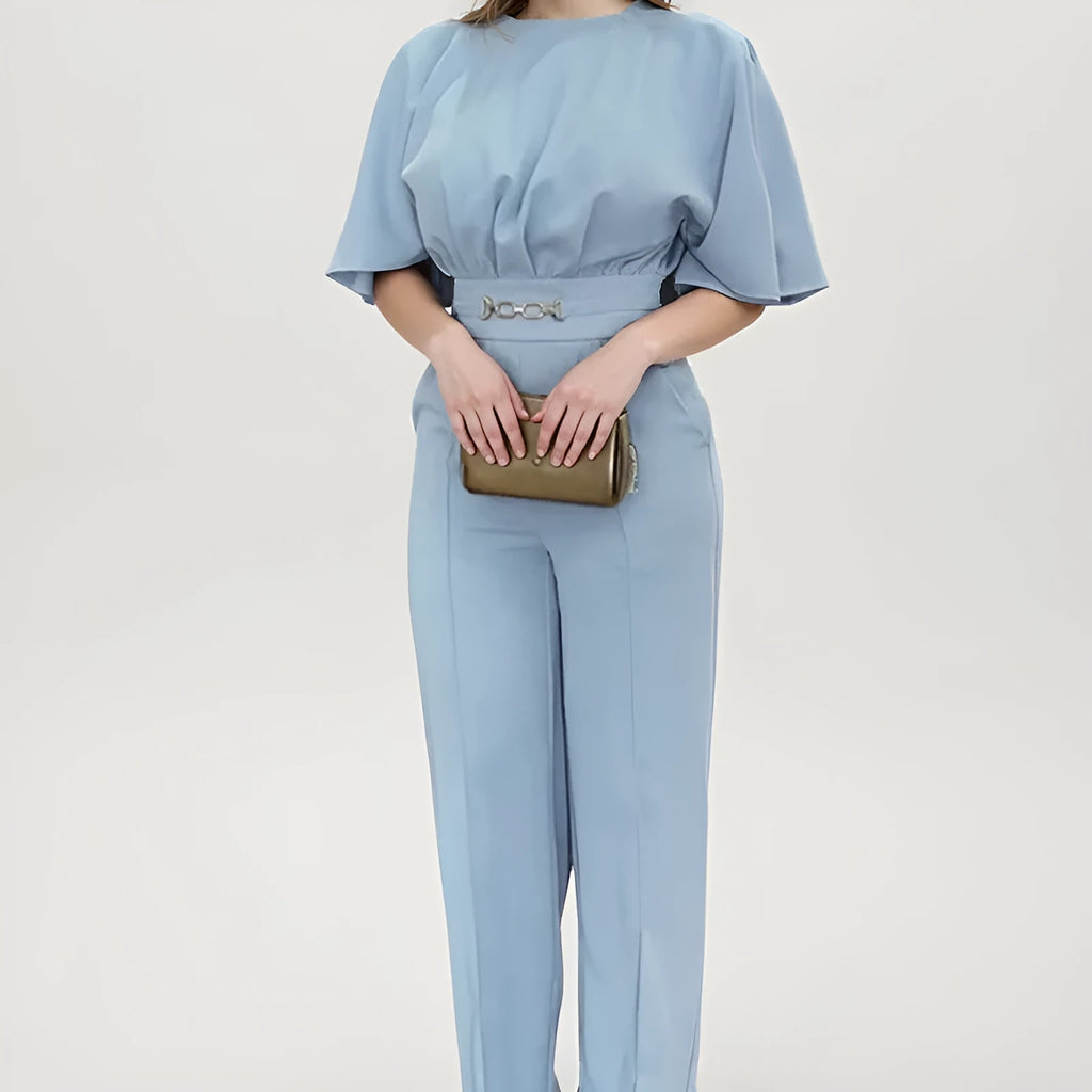 Men's blue polyester two-piece suit with long sleeve jacket and trousers on a hanger.