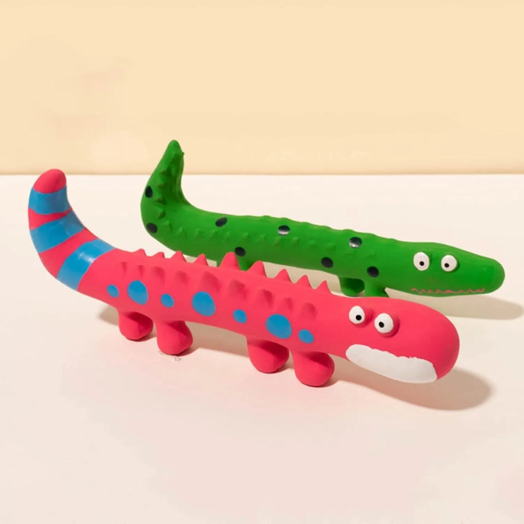 Green cartoon lizard dog chew toy with squeaker on white background