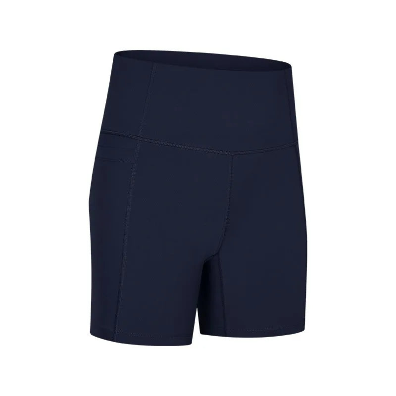 Women's tight-fitting sport shorts in a solid colour, shown on a model for running or gym use.