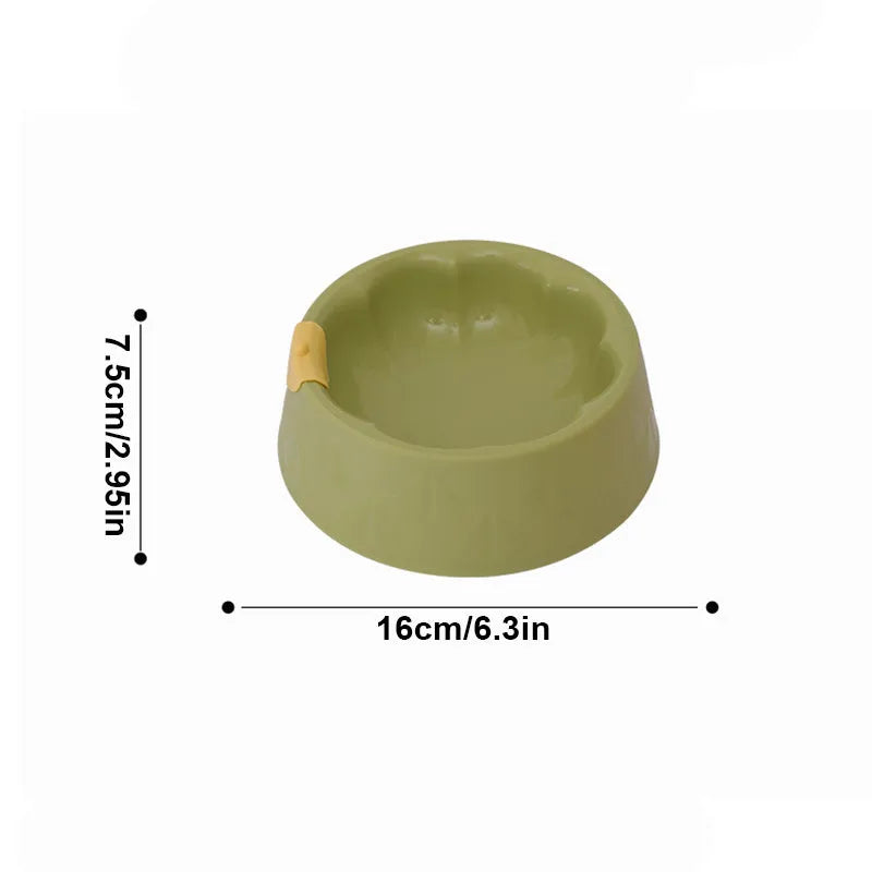 Green flower-shaped plastic pet bowl for cat or small dog food and water.