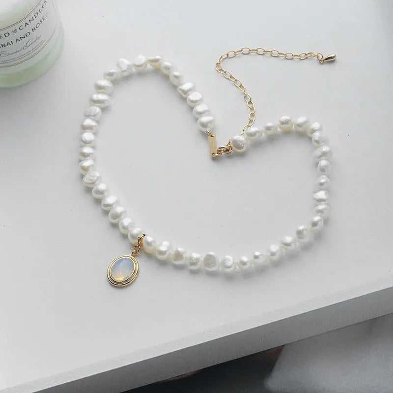 Silver geometric necklace with round medal and pearl pendant on adjustable chain
