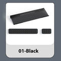 Double-sided black resin keyboard and mouse desk pad with integrated memory foam wrist rest.