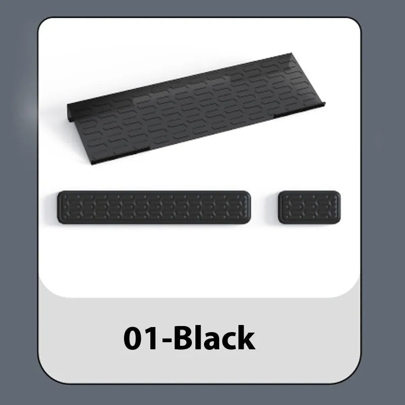 Double-sided black resin keyboard and mouse desk pad with integrated memory foam wrist rest.