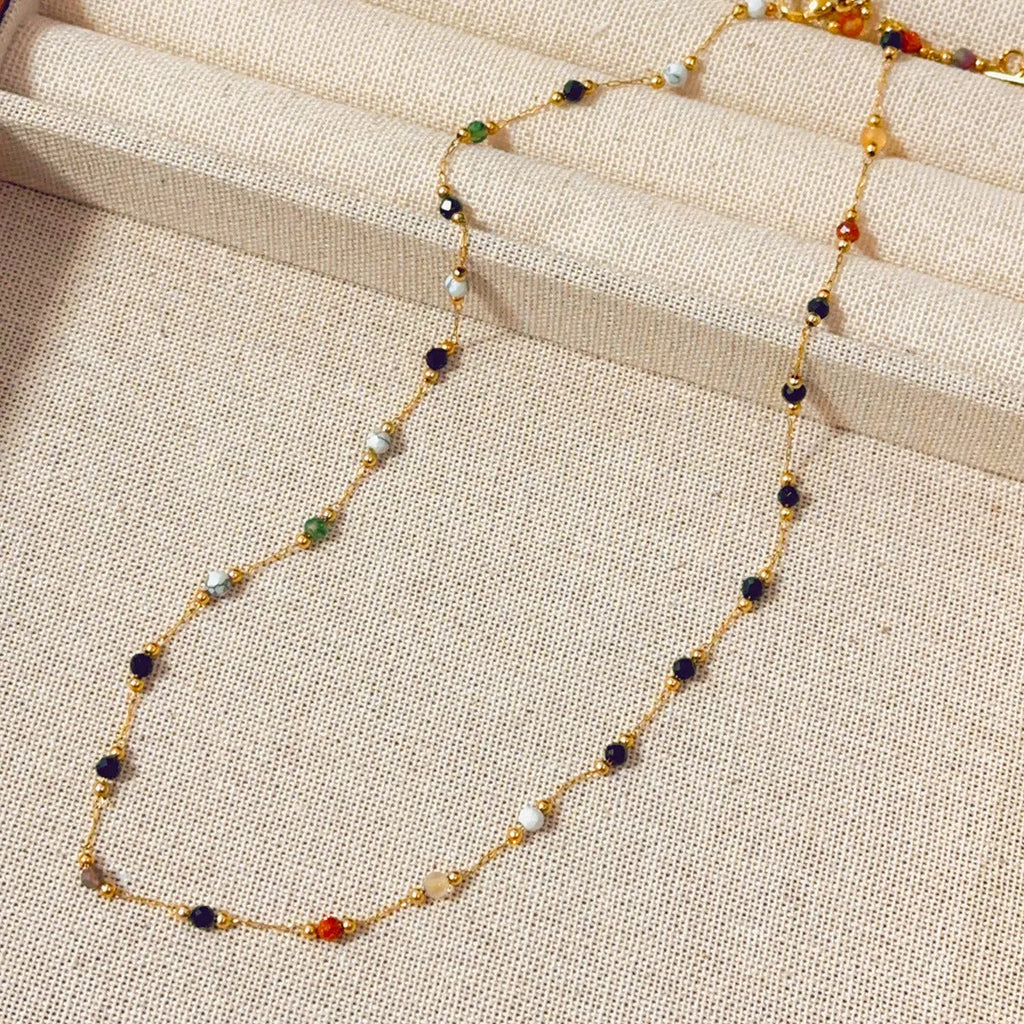 Gold titanium steel women's necklace with a natural stone pendant on an O-ring chain.
