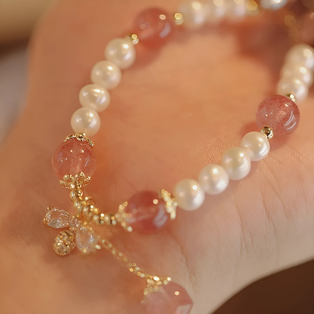 Women's strawberry quartz bracelet with stringed pearls and bow detail in INS style
