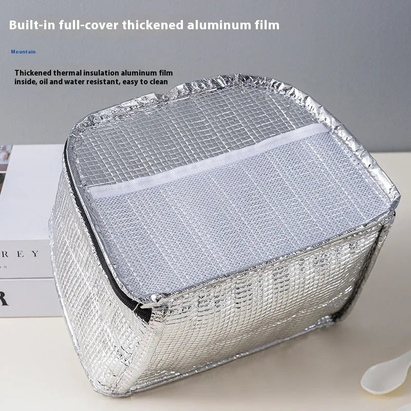 Large insulated lunch box bag in textured cloth, shown in blue colour with a bento box inside.