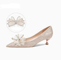 Champagne coloured women's stiletto pumps with sequin and crystal decoration on the upper