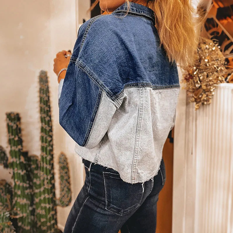 Women's blue denim coat with multi-buckle front closure and loose fit design