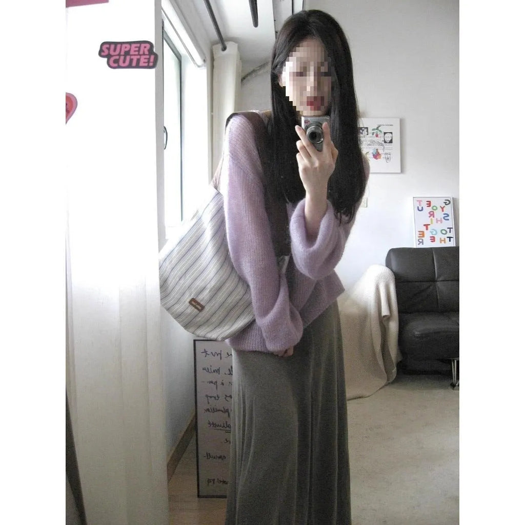Purple women's blouse with hollow out pattern, princess sleeves, and shoulder strap detail on hanger