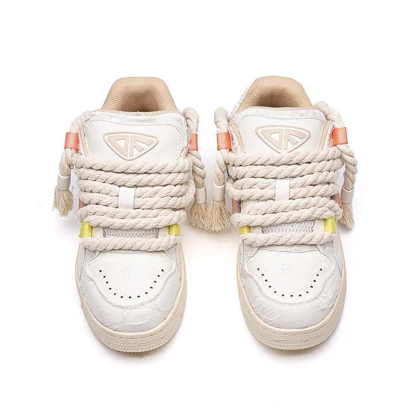 Creamy white low-top retro skate shoes with candy-colour sewing thread details on microfiber upper.
