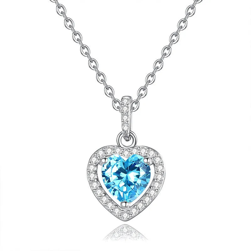 Sterling silver heart necklace with a choice of amethyst, citrine, topaz, olivine, or garnet gemstone on an adjustable chain.