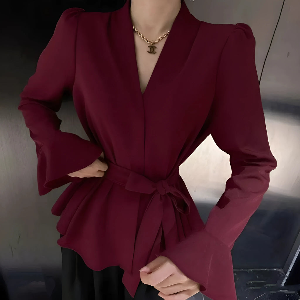 Women's black French-style shirt with an irregular collar, long flared bell sleeves, and a tied front closure.