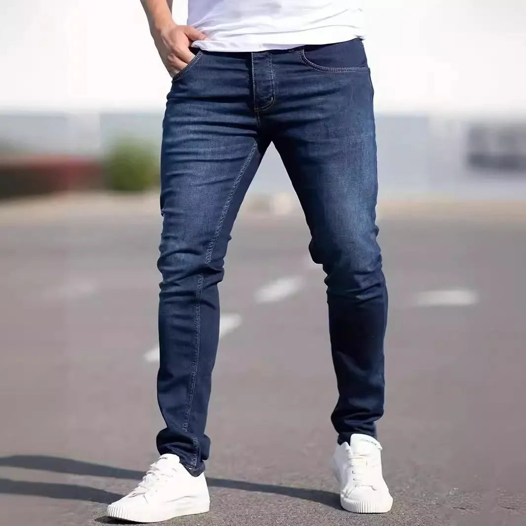 Men's dark blue slim fit casual jeans with skinny leg street fashion styling