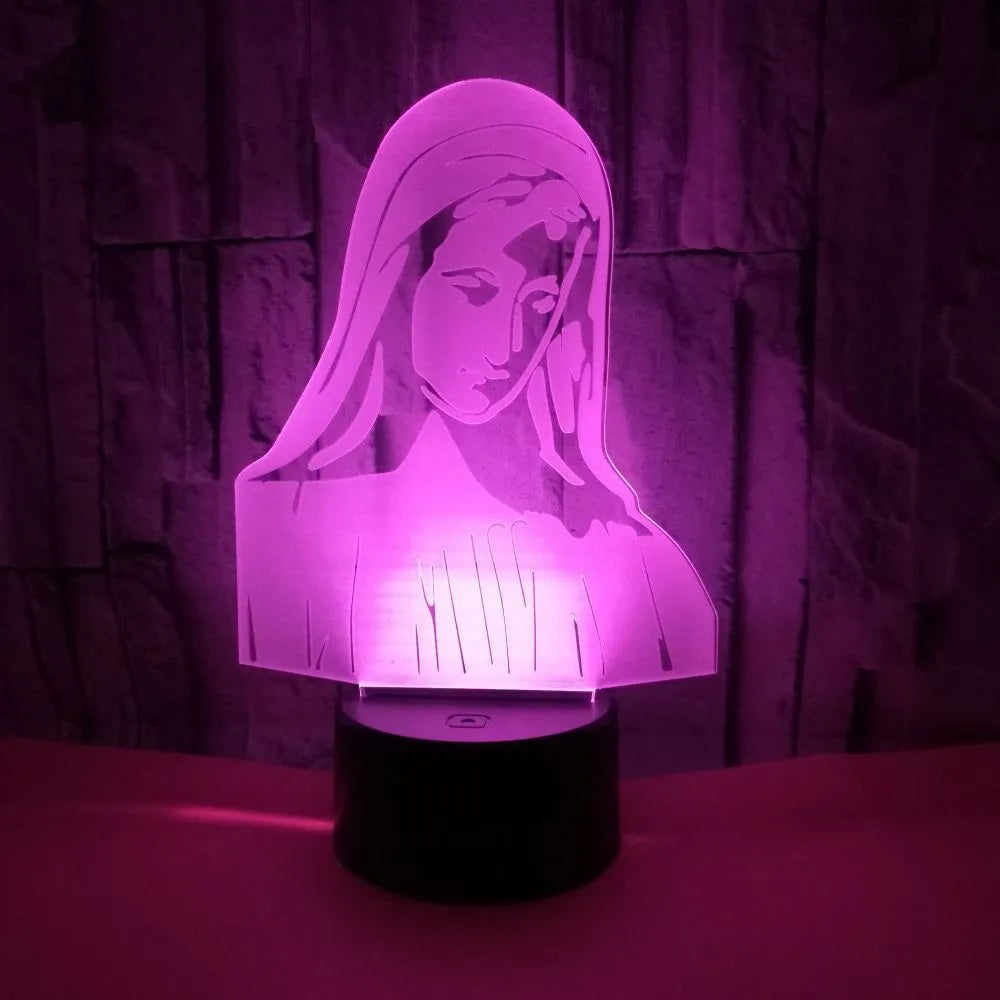 3D LED night light showing colourful dual ring pattern on acrylic panel, with remote control on desk.