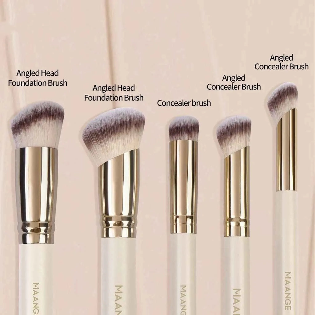 Five apricot-coloured angled makeup blush brushes with synthetic bristles arranged together